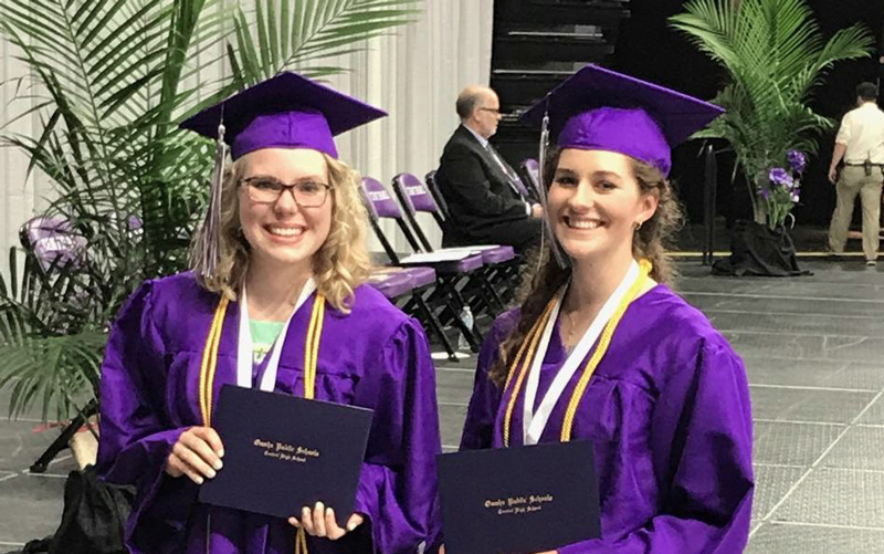 Central graduates, Maggie Winton and Clara Wolcott, with diploma in hand.